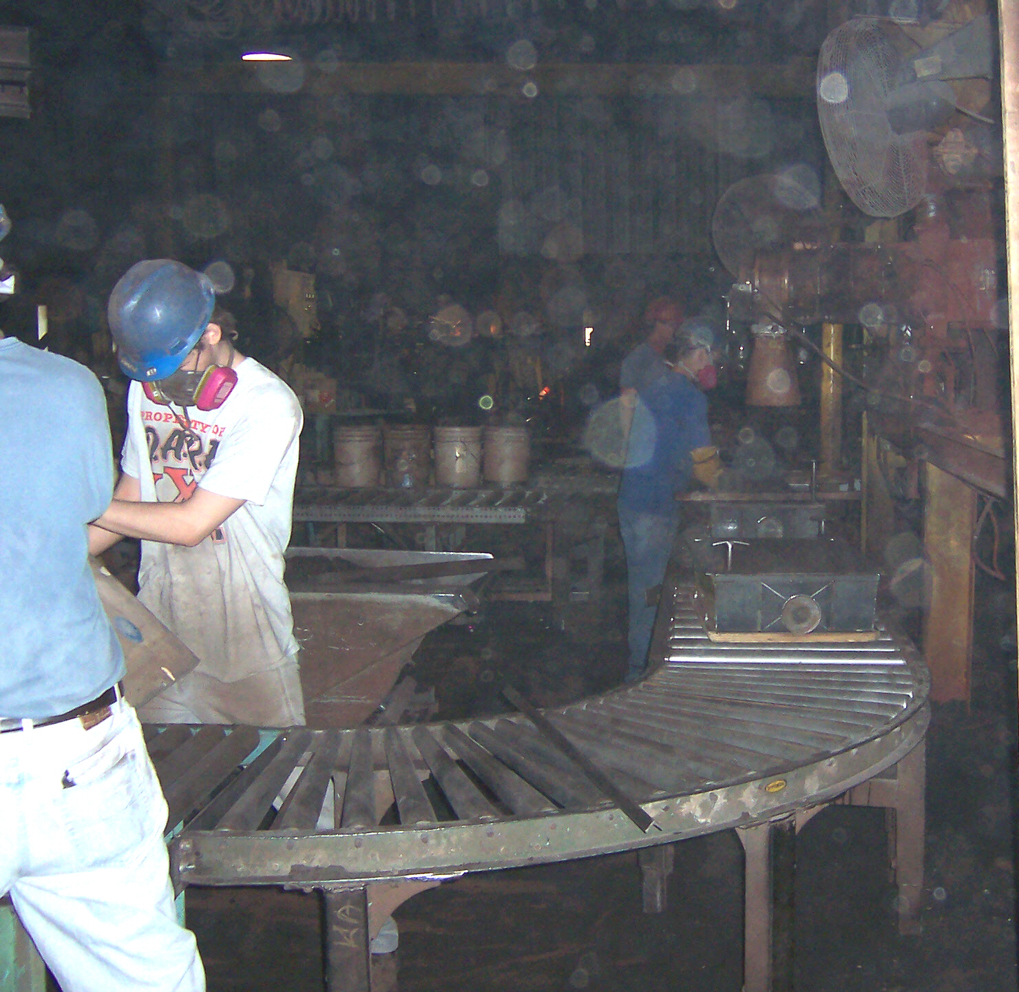 On the molding line. Sand being poured into pattern